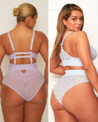 Two women wearing different styles of lingerie against a neutral background