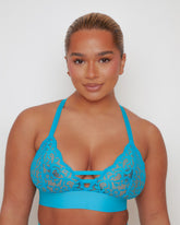 Close-up of the Amber Fuller Bust Bra in Bluebird Blue, featuring soft floral lace cups, decorative front strap detailing, adjustable shoulder straps, and a supportive underband designed for fuller busts.