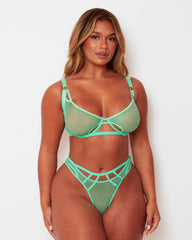 Front view of the Tutti Rouge Aphrodite Apple Green fishnet bra and thong set with cut-out detailing and gold-tone hardware.