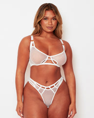 Front view of the Tutti Rouge Aphrodite white fishnet bra and thong set, featuring geometric cut-outs and high-cut legs.