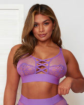 Front view of the Abigail Bralette, featuring a sheer polka-dot mesh bralette with lace-lined cups, criss-cross front strap detailing, adjustable straps.