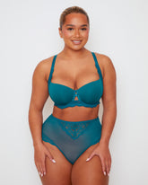 Model wearing Tutti Rouge Daley lace bra and Bellatrix high waist briefs in Blue Coral, shown from the front.