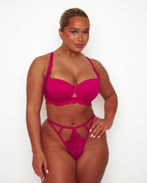 Front view of model wearing Tutti Rouge Daley Lace T-shirt bra in Cherry, paired with a coordinating strappy lace thong.