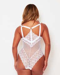 Rear view of the Tutti Rouge Eva White bodysuit, showing a strappy lace back, gold-tone heart sliders and scalloped lace edges.