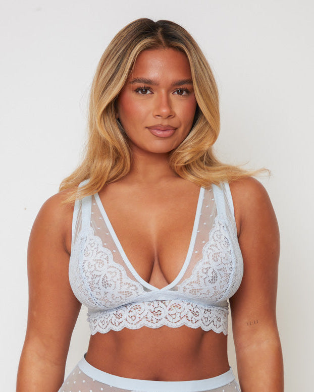 Front view of the Eva Bralette in Ballad Blue by Tutti Rouge, featuring delicate floral lace, sheer dotted mesh panels, and a flattering plunge neckline for a soft, feminine look.
