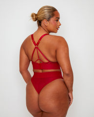 back view of the Tutti Rouge Julisa Fuller Bust Bralette and Brazilian Brief Set in Raspberry Red showcasing crossover straps, heart-shaped hardware and a sheer high-waist Brazilian brief.