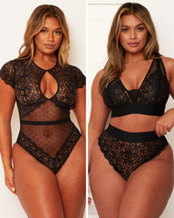 Black lace lingerie set worn by a model on a plain background