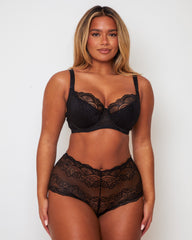 Front view of the Tutti Rouge Tutti Booster Lace Fuller Bust Bra in Luscious Liquorice paired with the matching lace shorts, showcasing elegant floral lace and supportive fuller bust design.
