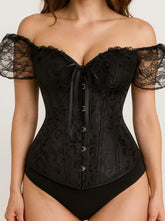 Black lace corset worn by a model on a plain background