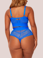 Blue lace lingerie set on a plain background