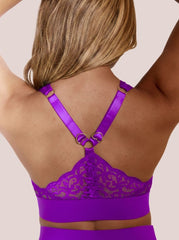 Purple lace lingerie set on a neutral background