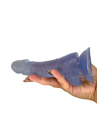 Hand holding a frosted ice blue silicone product against a white background