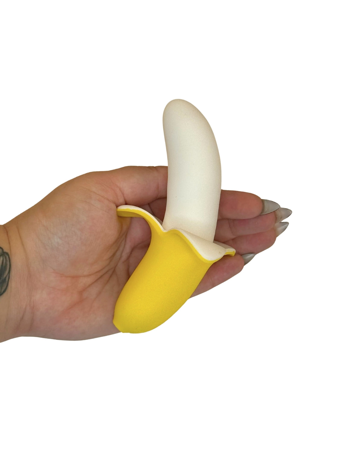 Brand X toys Buzzy Banana vibrating adult toy shaped like a peeled banana, held in hand