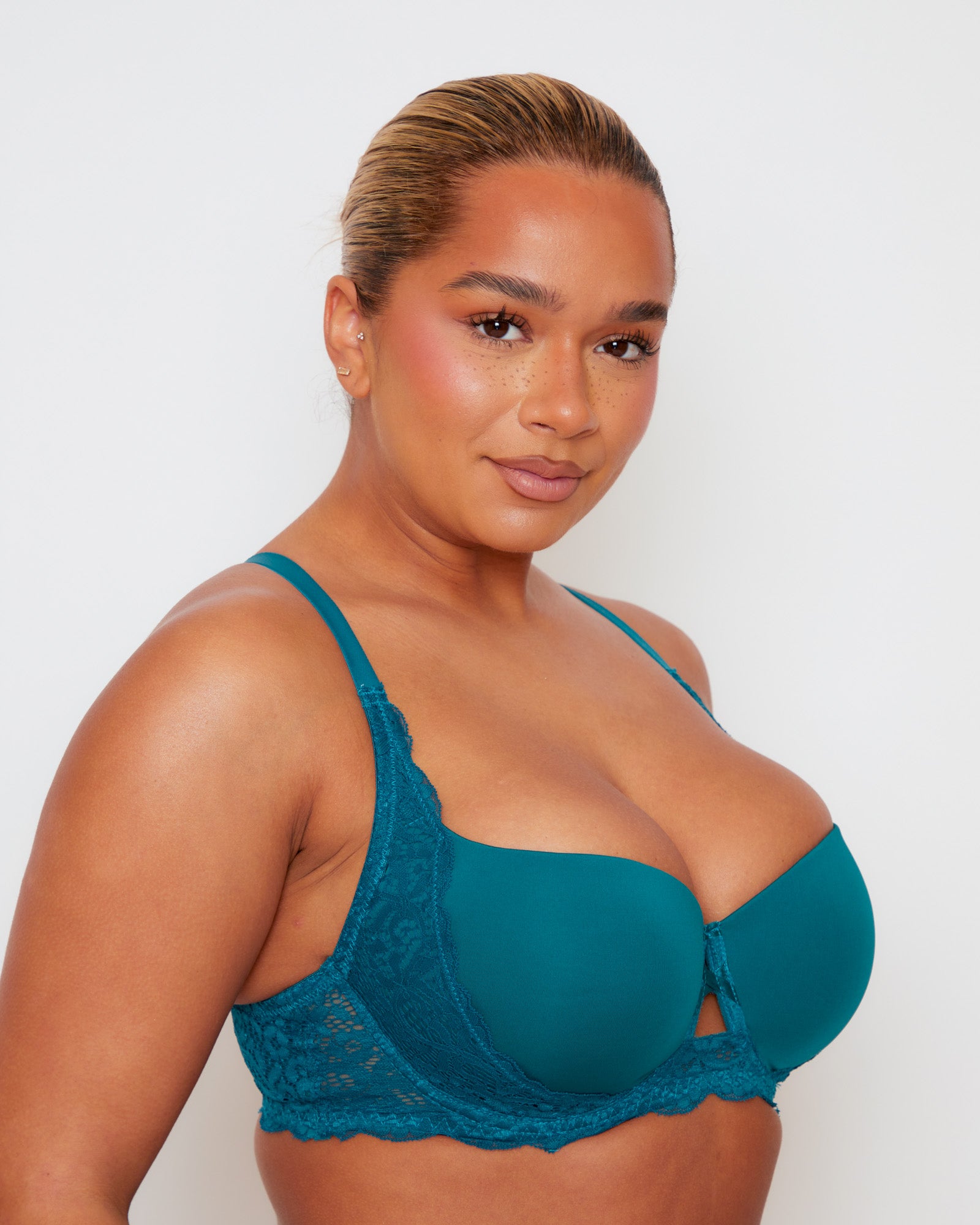 Angled close-up of Tutti Rouge Daley bra in Blue Coral, showing smooth moulded cups and floral lace side panels.