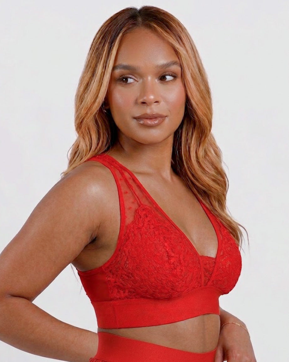 Model wearing the Hallie Fuller Bust Lace Bralette in Chilli Pepper Red, featuring soft stretch floral lace, supportive wireless cups, sheer mesh neckline and a wide comfort underband.