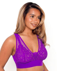 Model wearing the Hallie Fuller Bust Lace Bralette in Passion Purple, featuring delicate floral lace, sheer mesh panels, wireless support and a wide comfort underband designed for fuller busts.