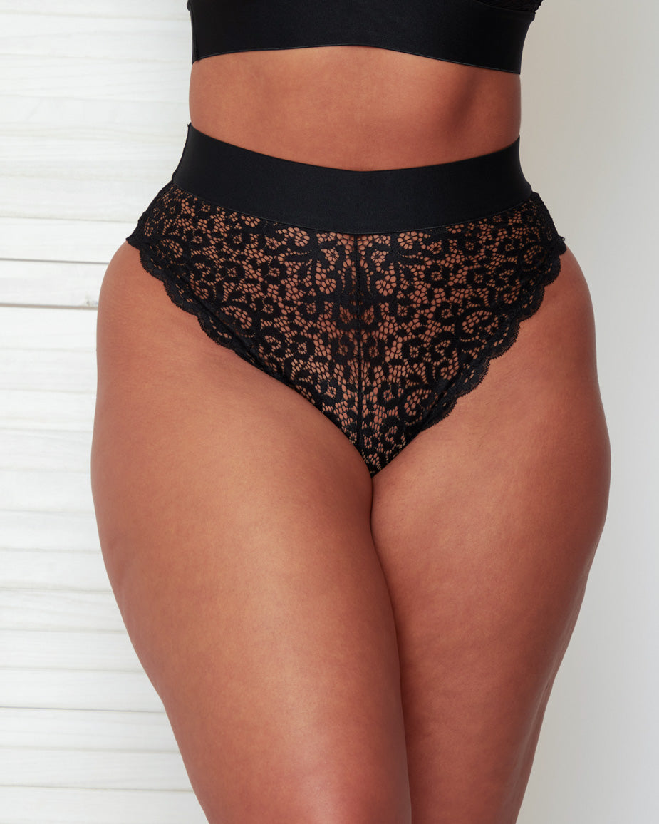 Detailed front view of the Hallie Brazilian Brief in Black by Tutti Rouge, showcasing soft floral lace construction, scalloped edges, and a smooth supportive waistband.