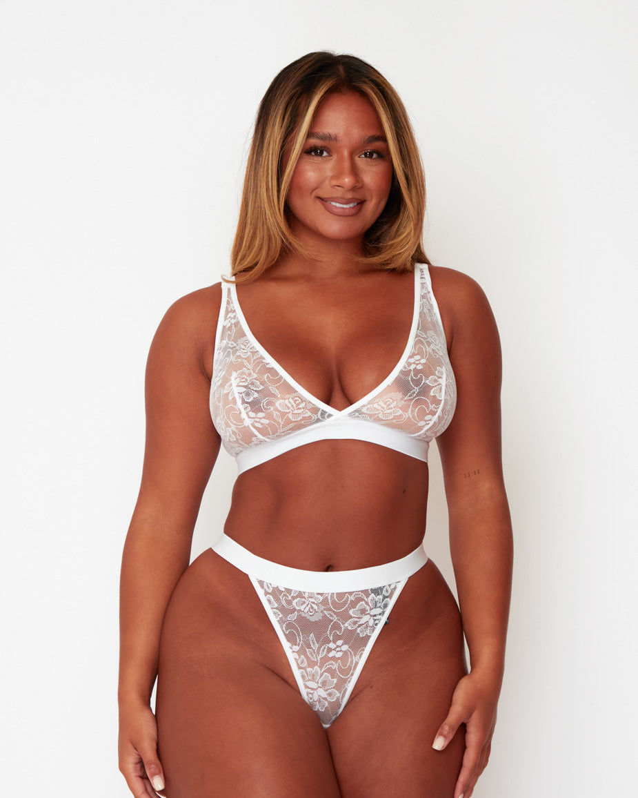 Full-length front view of the Millie-Mae Fullerbust Triangle Bralette and Thong Set in Ice White, featuring soft sheer floral lace, a flattering plunge neckline, and a matching no-VPL thong designed for curves.