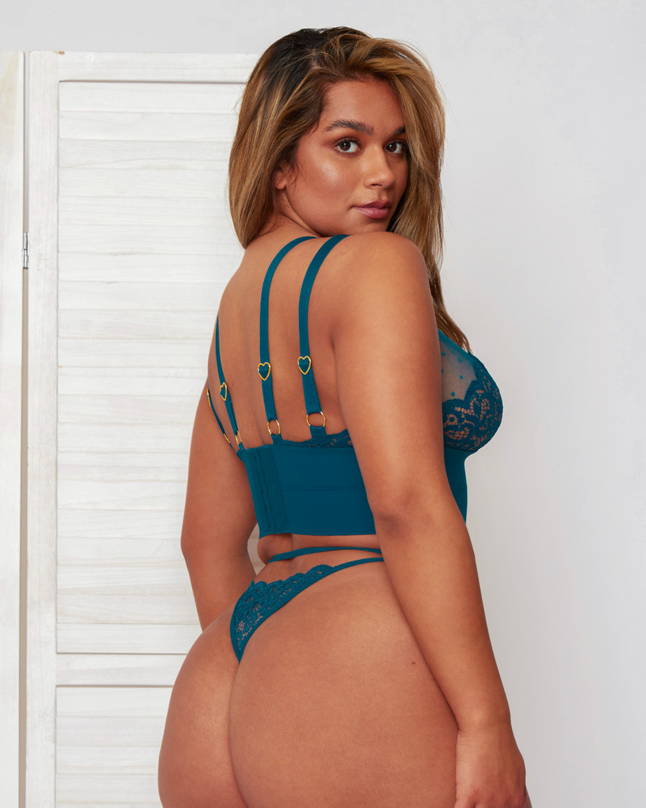 Back view of the Morgon Bralette and Brief set in Blue Coral, highlighting the adjustable multi-strap construction, secure hook-and-eye fastening, and lace thong design with minimal coverage.