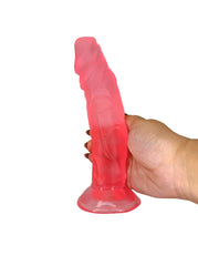 Hand holding a pink silicone object against a white background