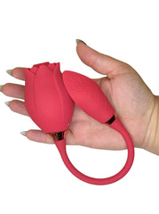 Red tulip-shaped object held in a hand against a white background