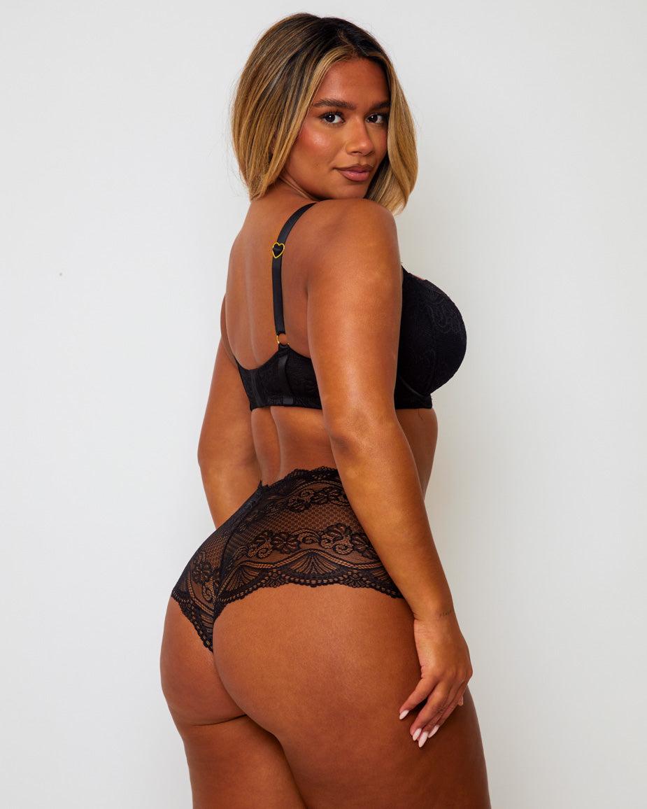 Back view of the Tutti Rouge Tutti Booster Lace Fuller Bust Bra in Luscious Liquorice featuring adjustable straps with gold heart hardware and a secure hook-and-eye fastening.