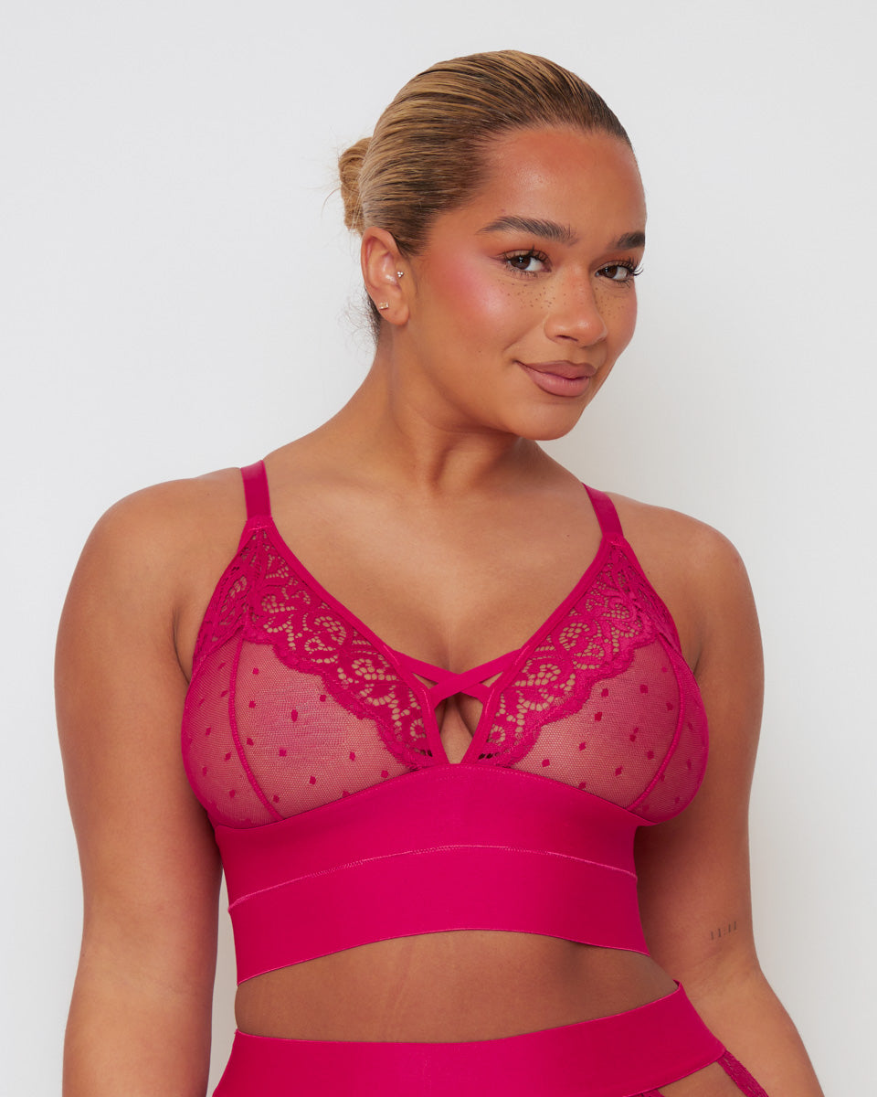 Close-up of the Tutti Rouge Victoria Bralette in Very Cherry highlighting sheer dotted mesh, floral lace trim, plunge neckline and supportive longline underband.