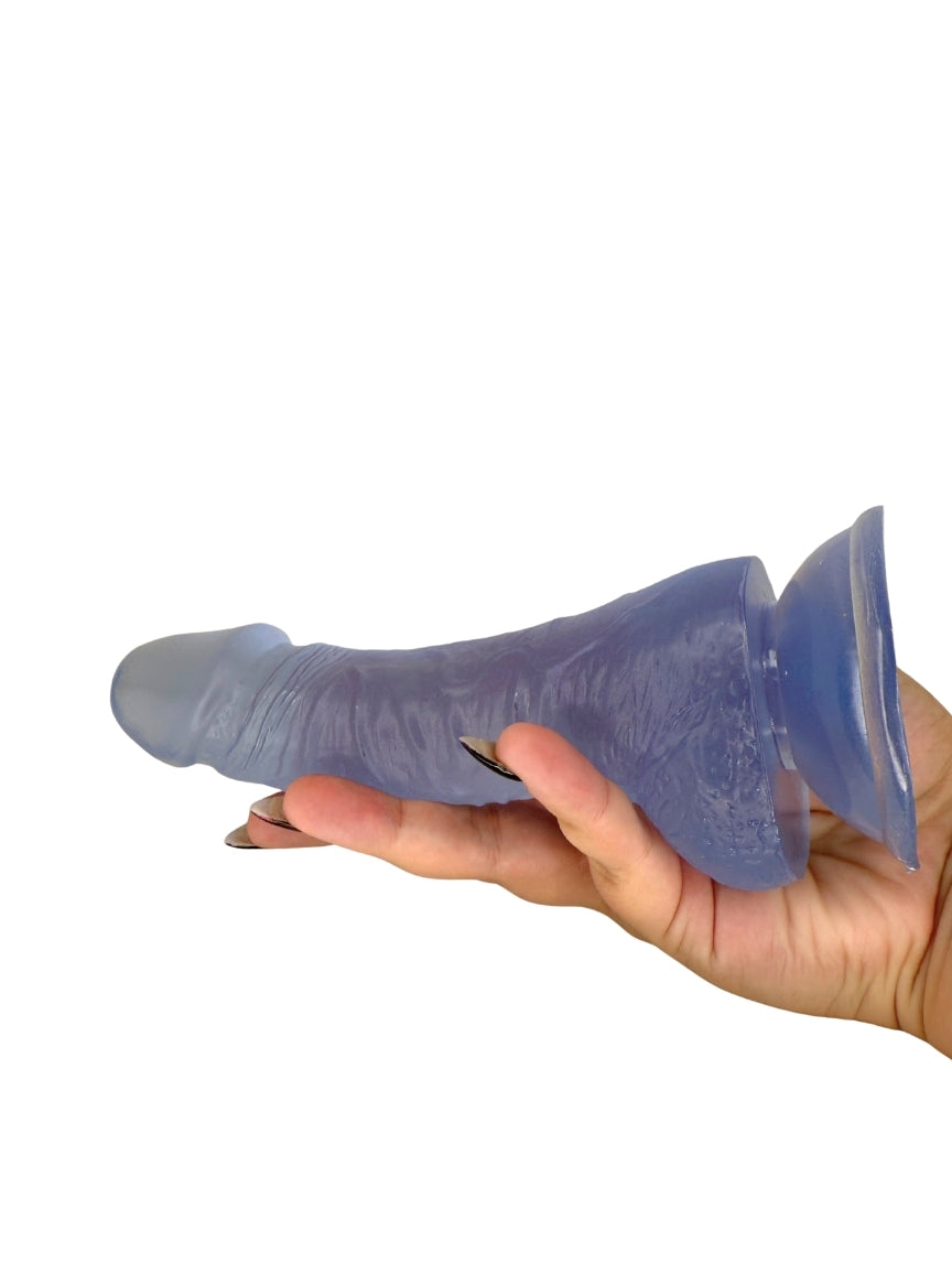 Hand holding a frosted ice blue silicone product against a white background