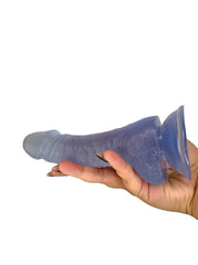 Hand holding a frosted ice blue silicone product against a white background